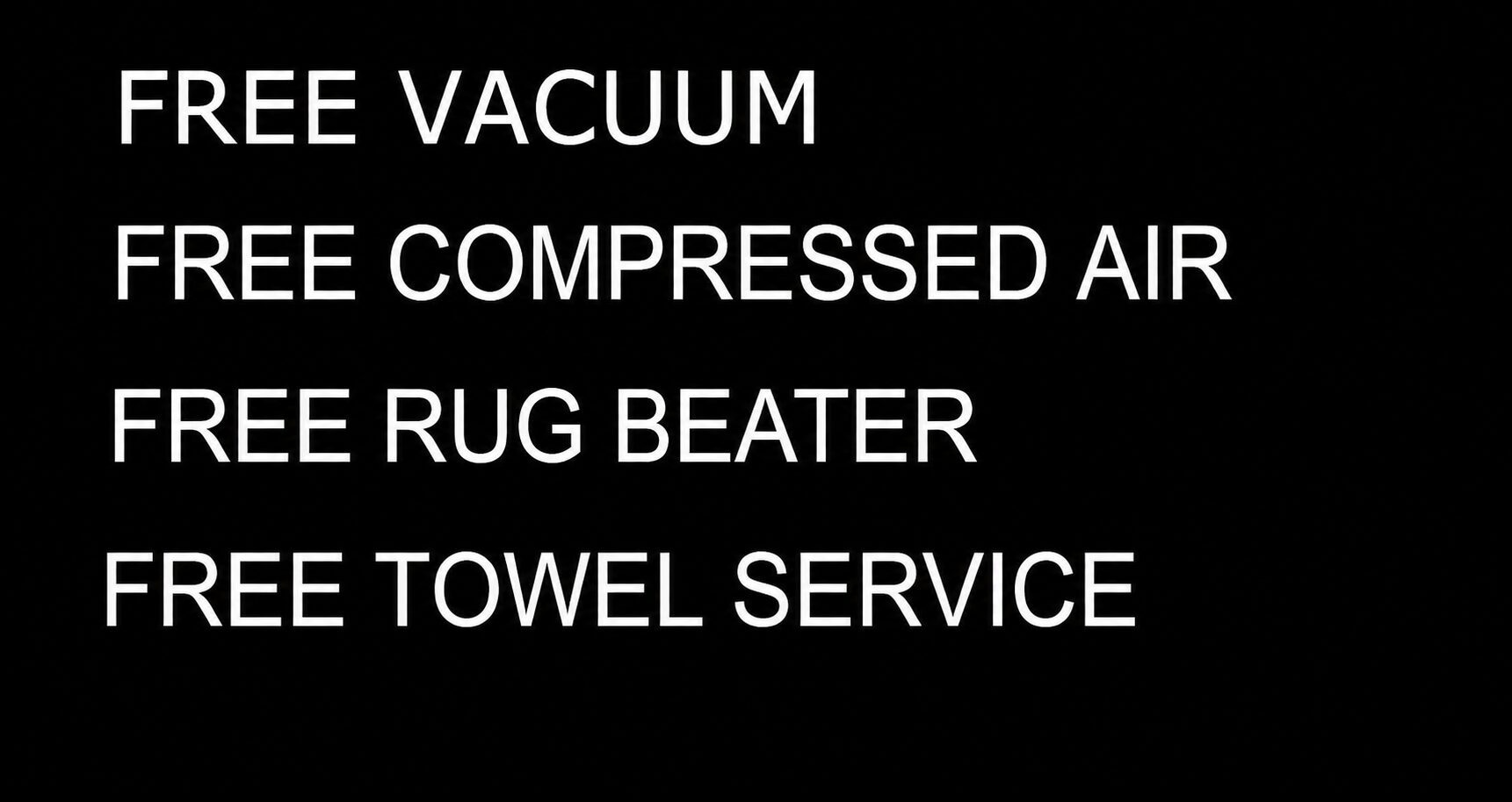 Black sign listing free vacuum and towel service